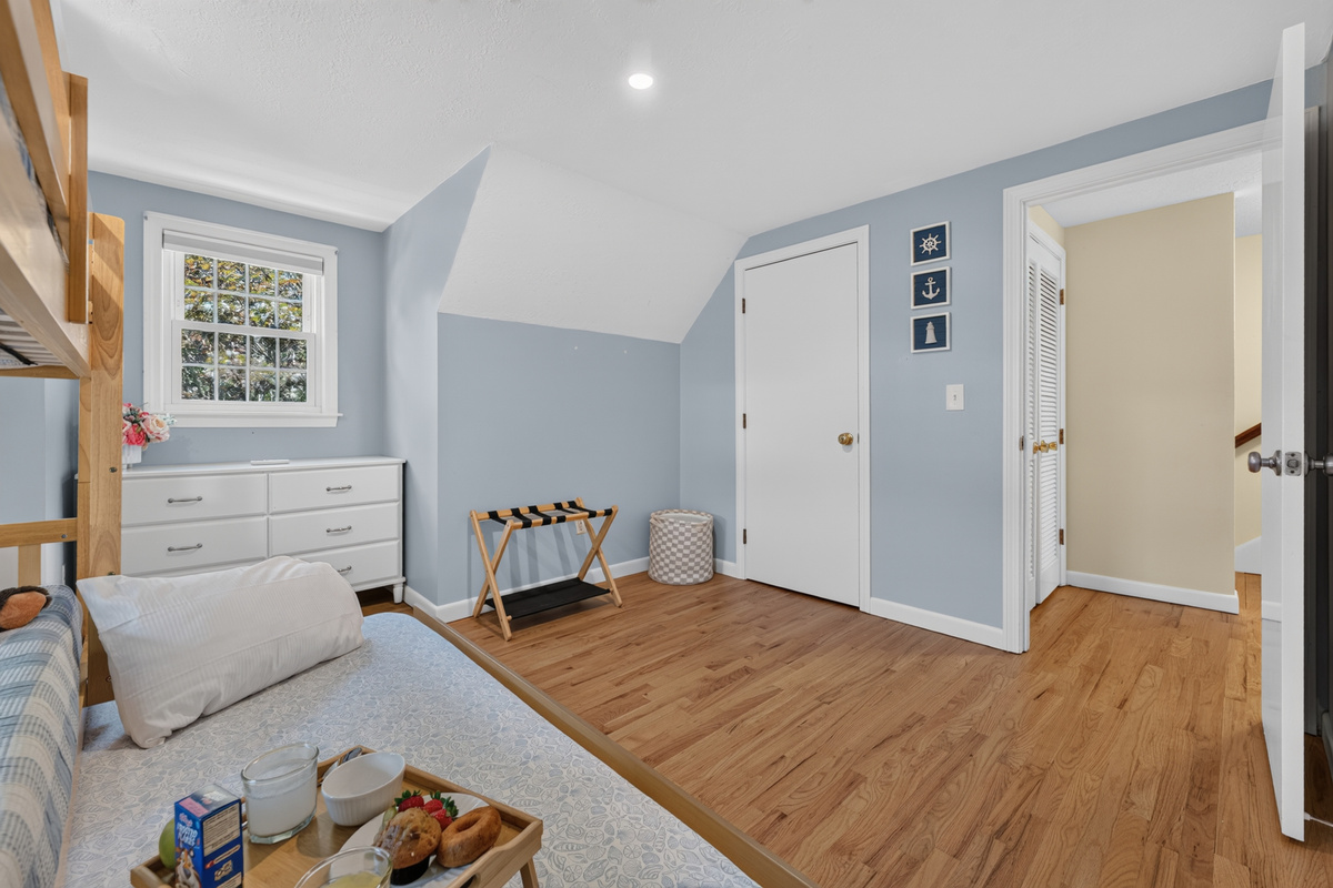 Bright and spacious bunk room offering comfort, flexibility, and room to unwind.