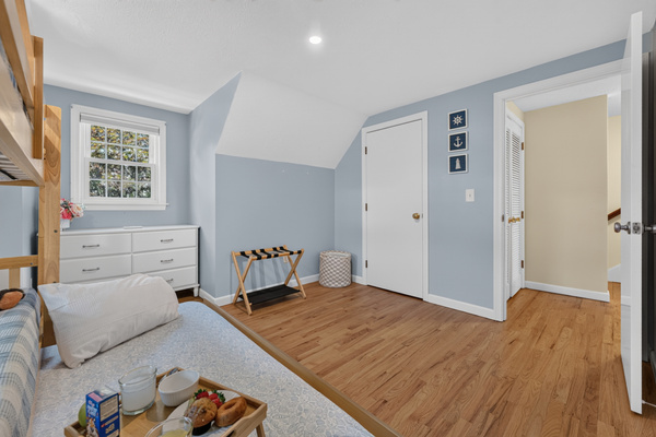 Bright and spacious bunk room offering comfort, flexibility, and room to unwind.