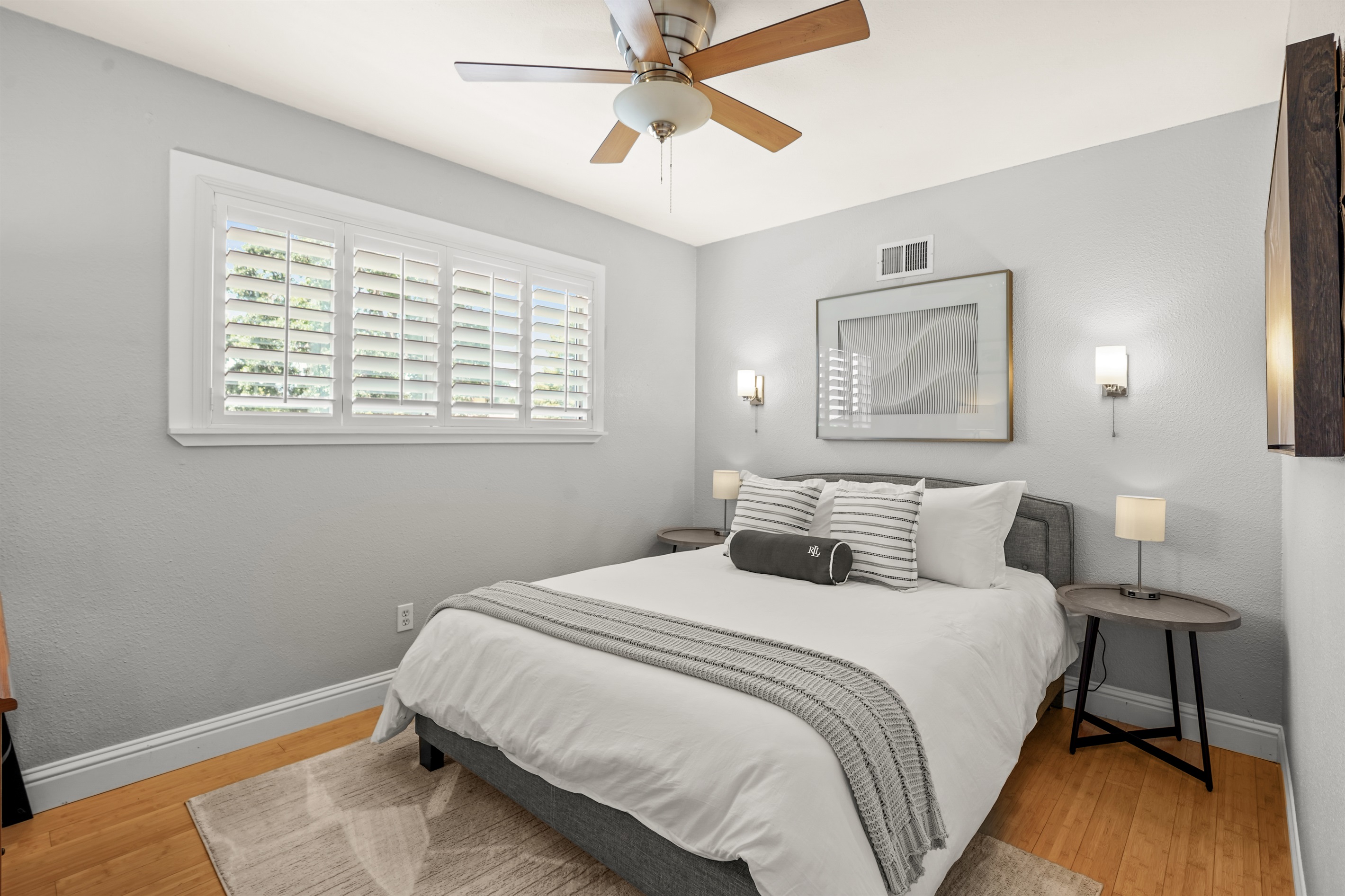 Comfortable upstairs bedroom with a queen bed and closet space for guest belongings.