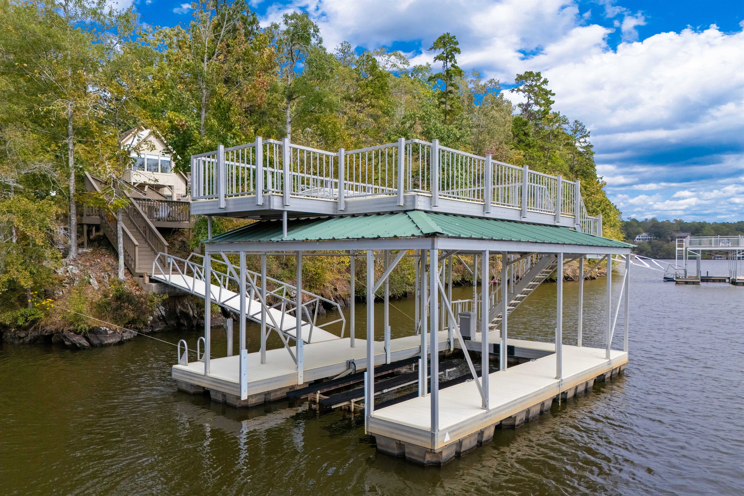 The dock is ideal for boating and swimming, offering easy water access and a great spot to relax and enjoy the lake.