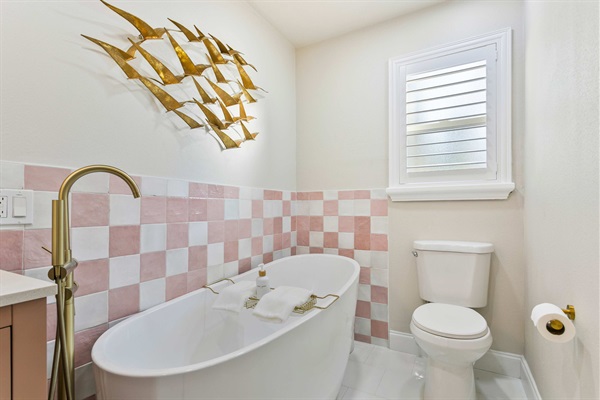 Master bathroom with glass shower and a separate soaking tub