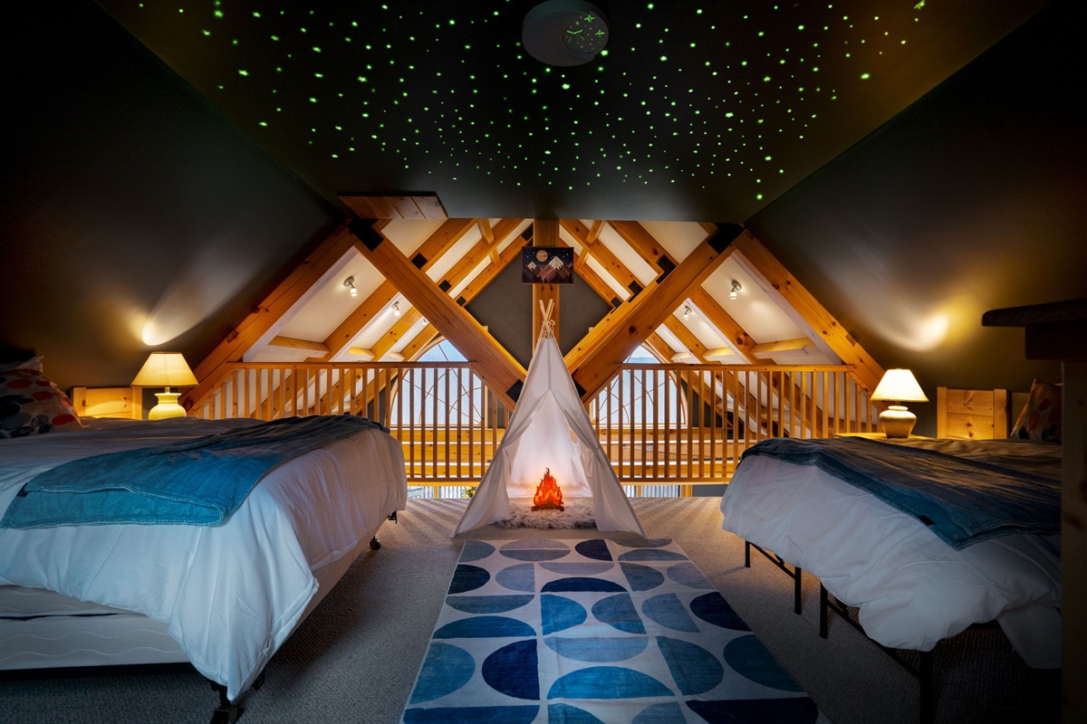Drift off beneath a ceiling of stars in the magical loft, a dreamy retreat that feels both playful and serene.