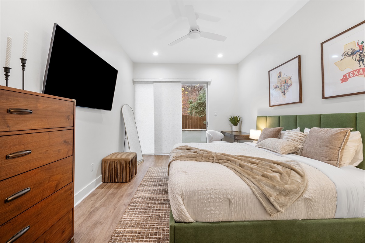 Large King size bed with Smart TV and a private patio.