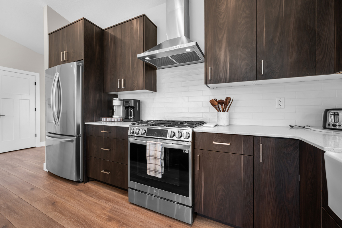 Fully equipped chef's kitchen with stainless steel appliances, gas range, and ample counter space for preparing vacation meals.