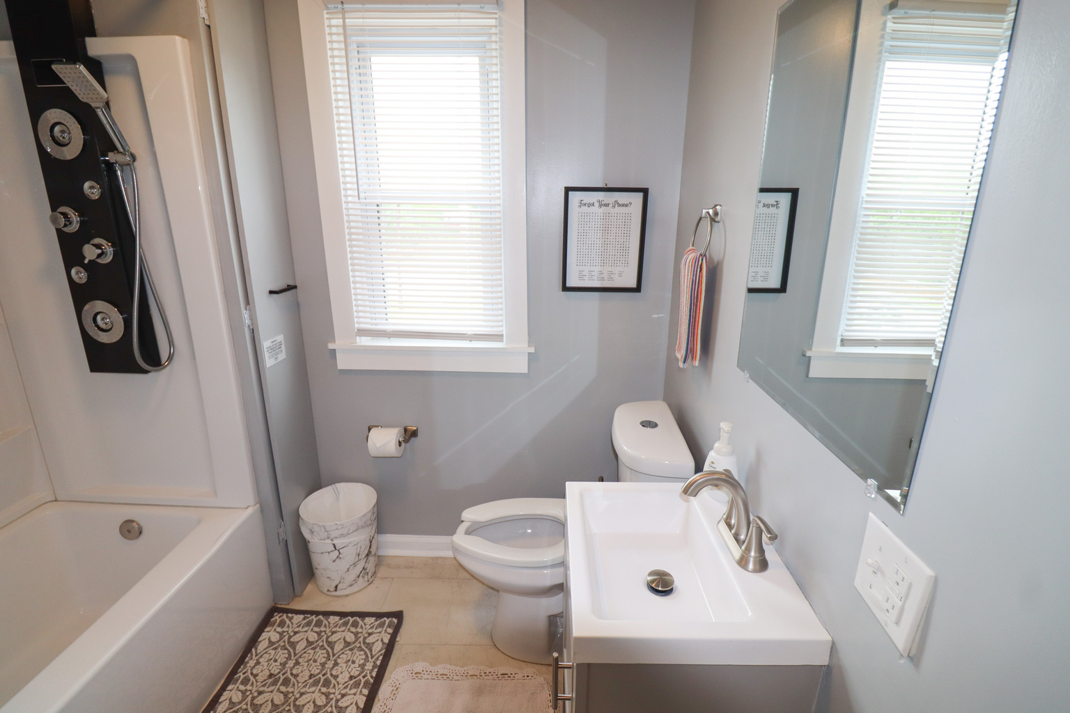 Full Bathroom with Tub and Shower and deluxe shower head