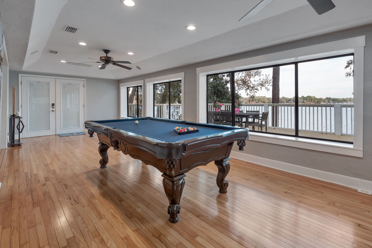 Pool table, lake view, stool seating, tv, deck and dock access