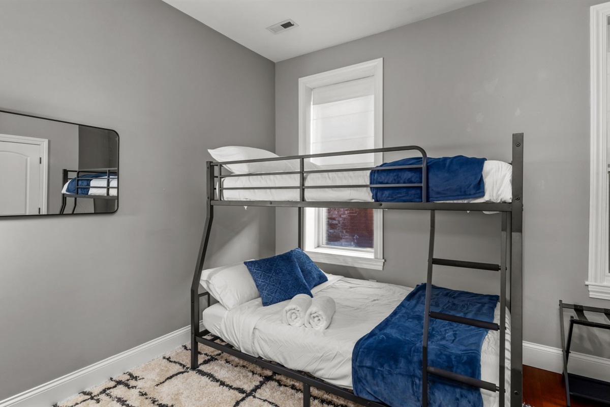 Bedroom two is equipped with a Full XL over Queen bunk bed.  Note that while these beds can accommodate more, the max occupancy for this property is 6 people.  The bunks add more options when