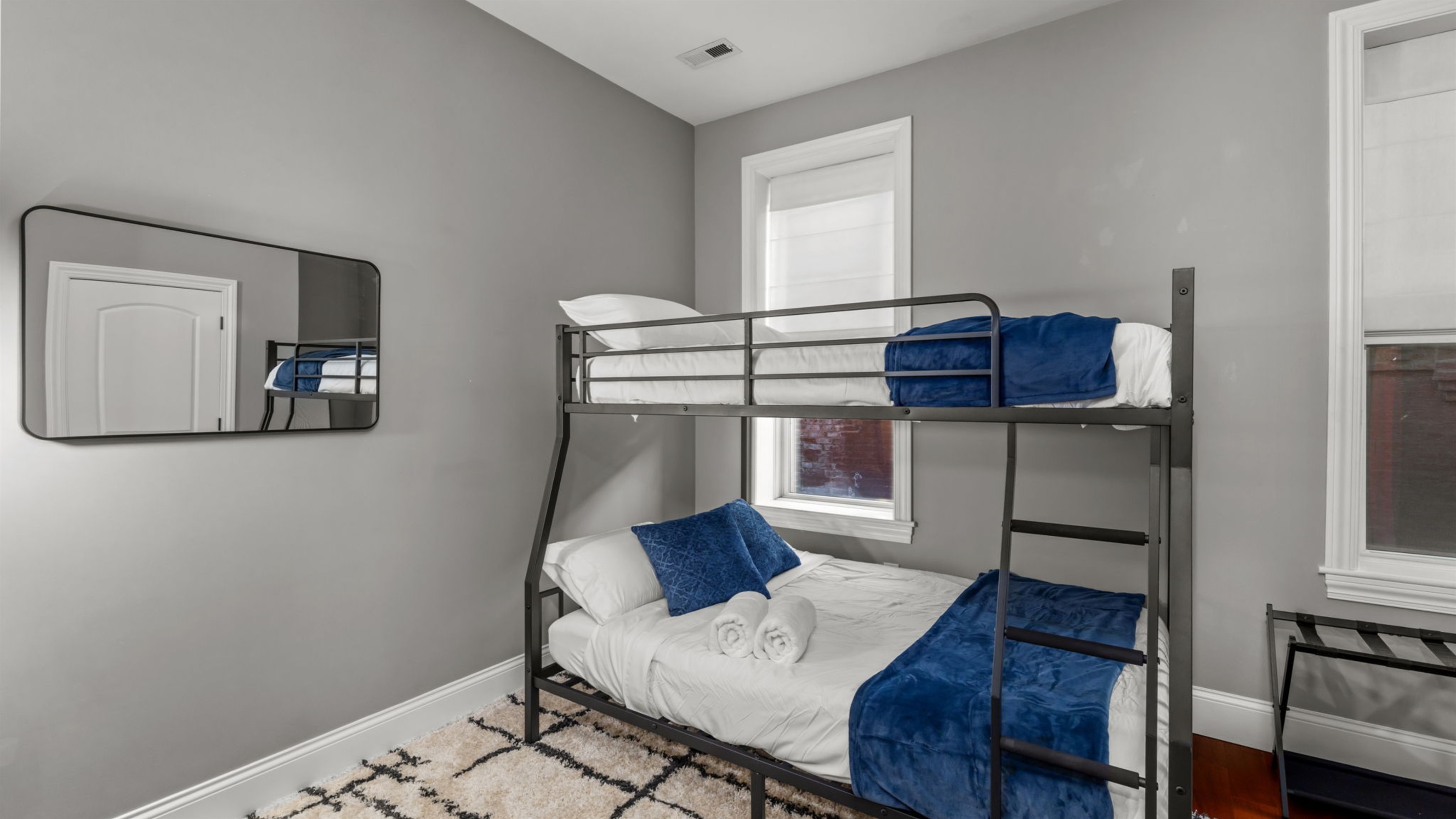 Bedroom two is equipped with a Full XL over Queen bunk bed.  Note that while these beds can accommodate more, the max occupancy for this property is 6 people.  The bunks add more options when