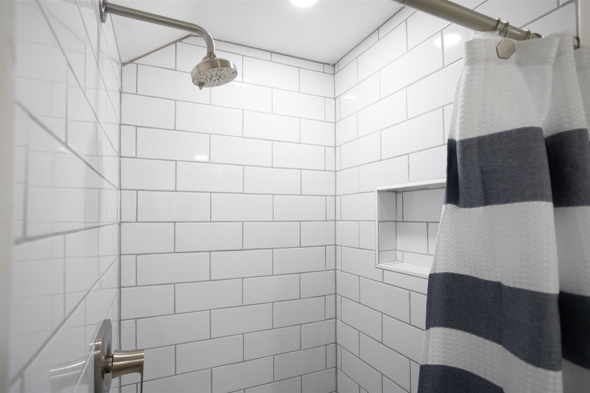 Step into the walk-in shower for a refreshing start—or a relaxing end—to your day.