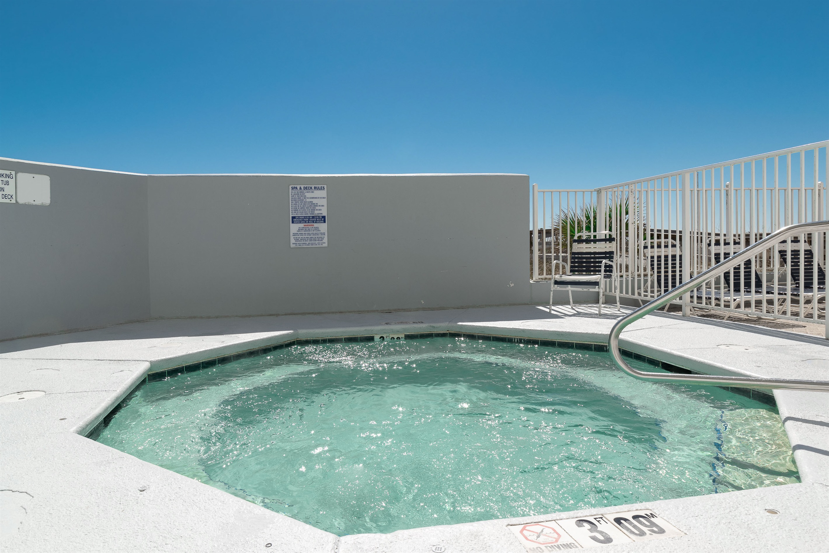This inviting hot tub offers a serene escape with views of the surrounding resort amenities.