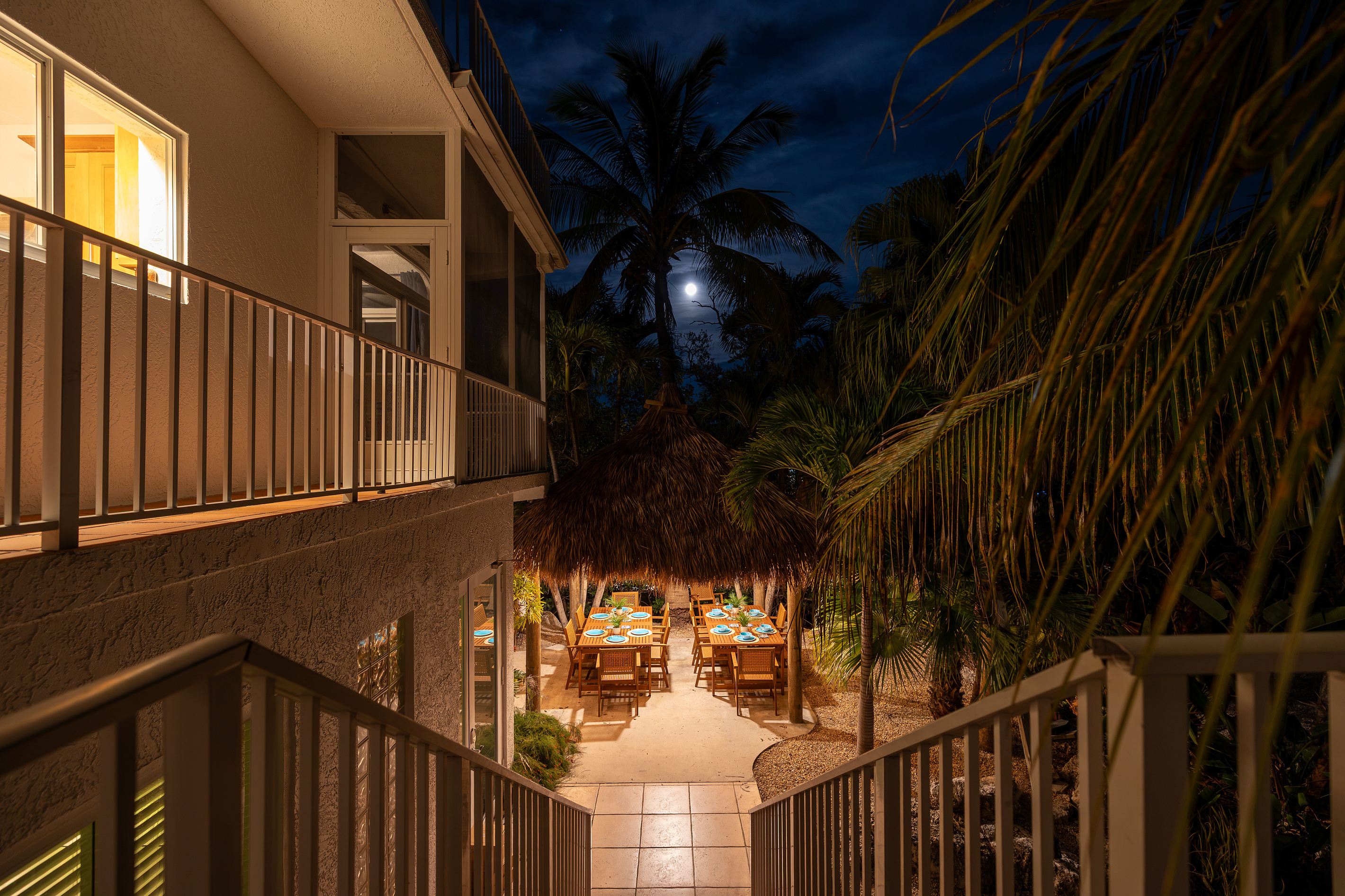 Heading down to the tiki hut, lit up for the night.