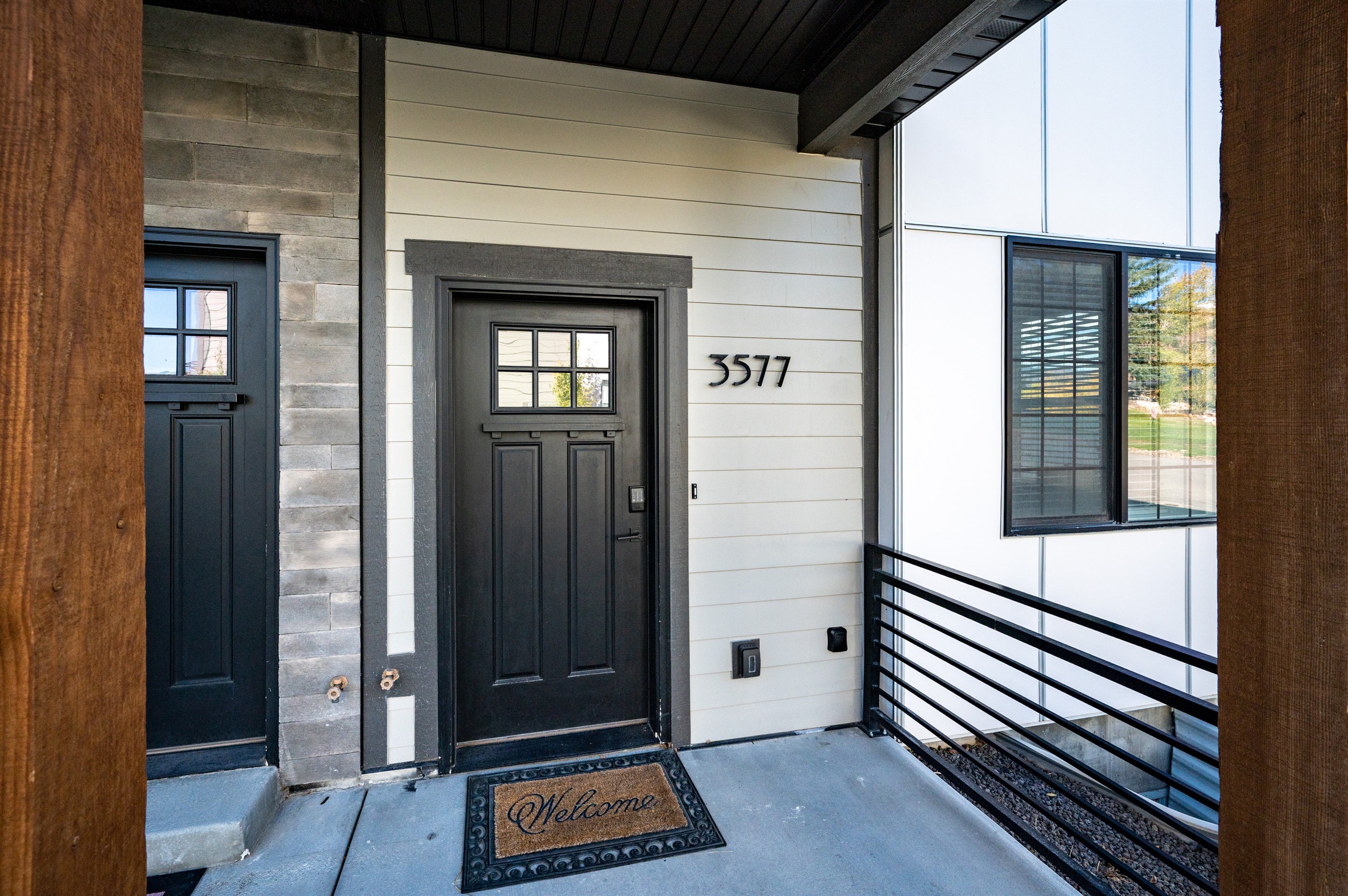 Welcoming front entry with keypad access and modern finishes.