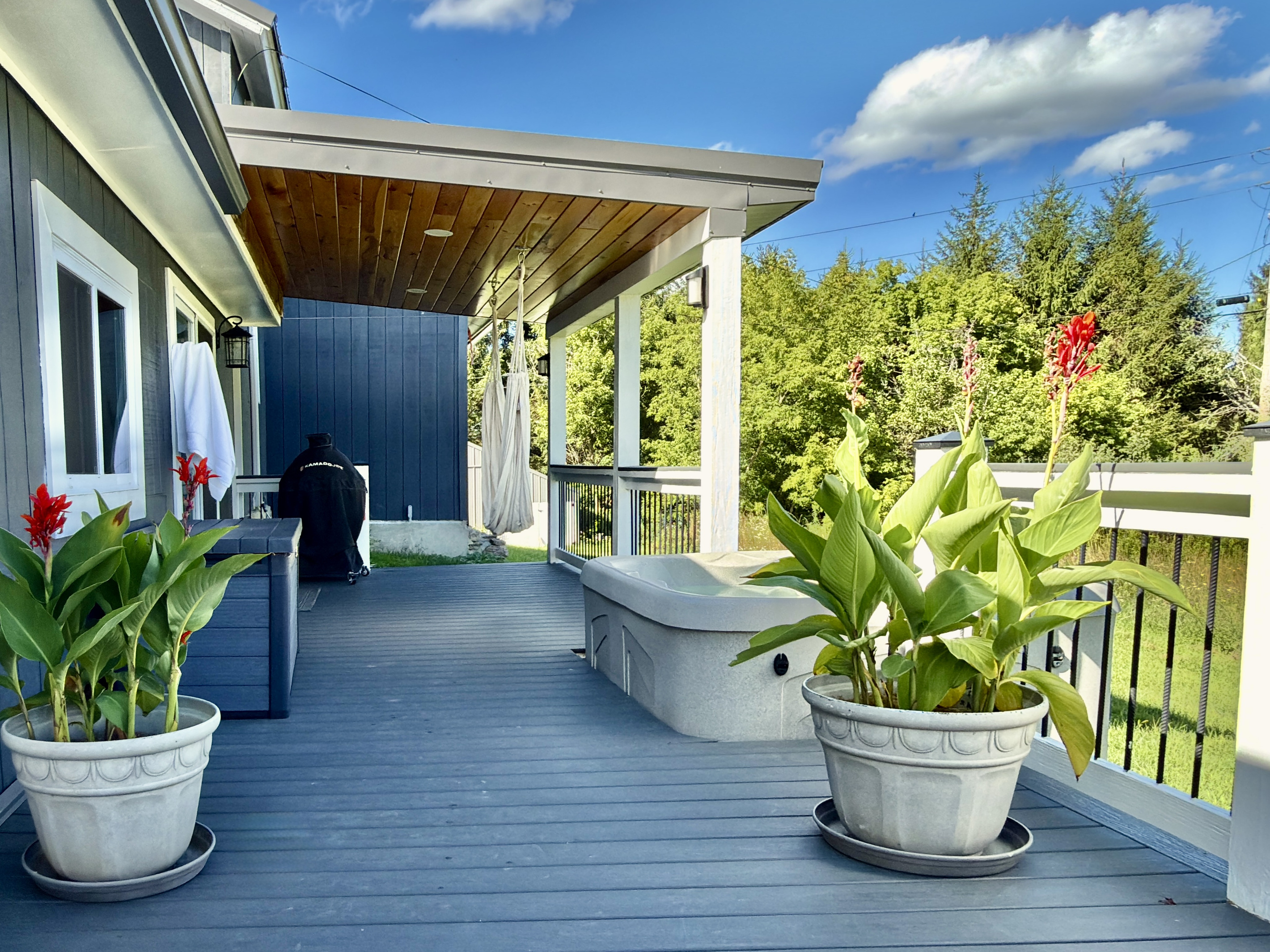 The ultimate outdoor retreat. Unwind in the private hot tub, sink into the hanging hammock chair with a good book, or fire up the grill for an afternoon barbecue—all while enjoying the peaceful tree-lined views from our covered wrap-around deck.