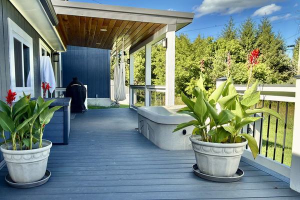The ultimate outdoor retreat. Unwind in the private hot tub, sink into the hanging hammock chair with a good book, or fire up the grill for an afternoon barbecue—all while enjoying the peaceful tree-lined views from our covered wrap-around deck.