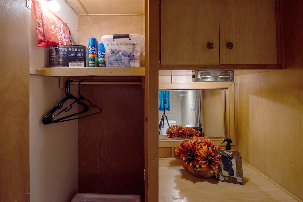 Storage and supplies across from the toilet and laundry room
