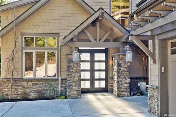 Sophisticated front entry with double doors, providing convenient access for all guests.