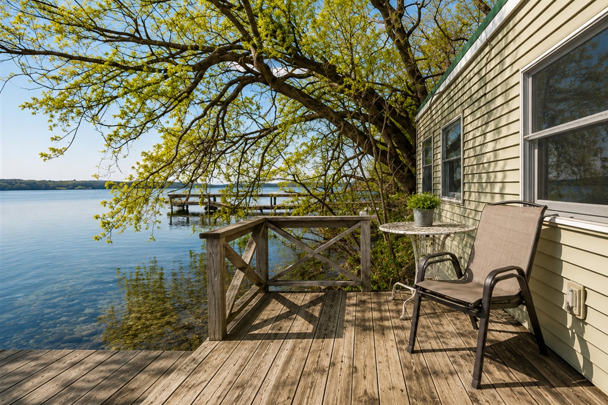 Lakefront / Boathouse / Dock (requires three flights of stairs to access) -  Savor the view from this charming lakeside deck, an inviting spot perfect for morning coffees or sunset gazing right on the water's edge.