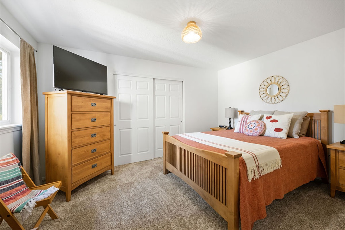 Bedroom 3 Queen bed with smart TV, dresser and full closet.