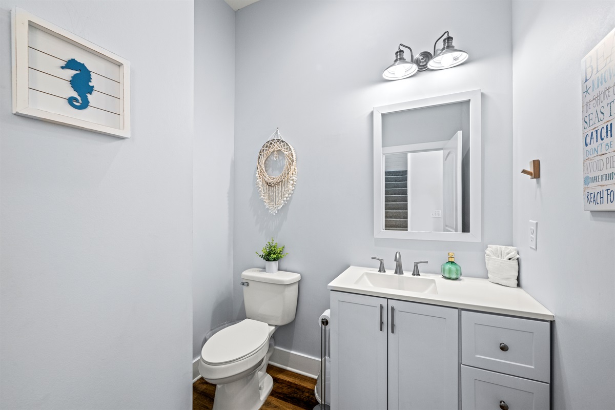 Fresh, clean, and convenient. This bright half bath makes it easy for everyone to get ready between beach days, pool time, and dinner out.