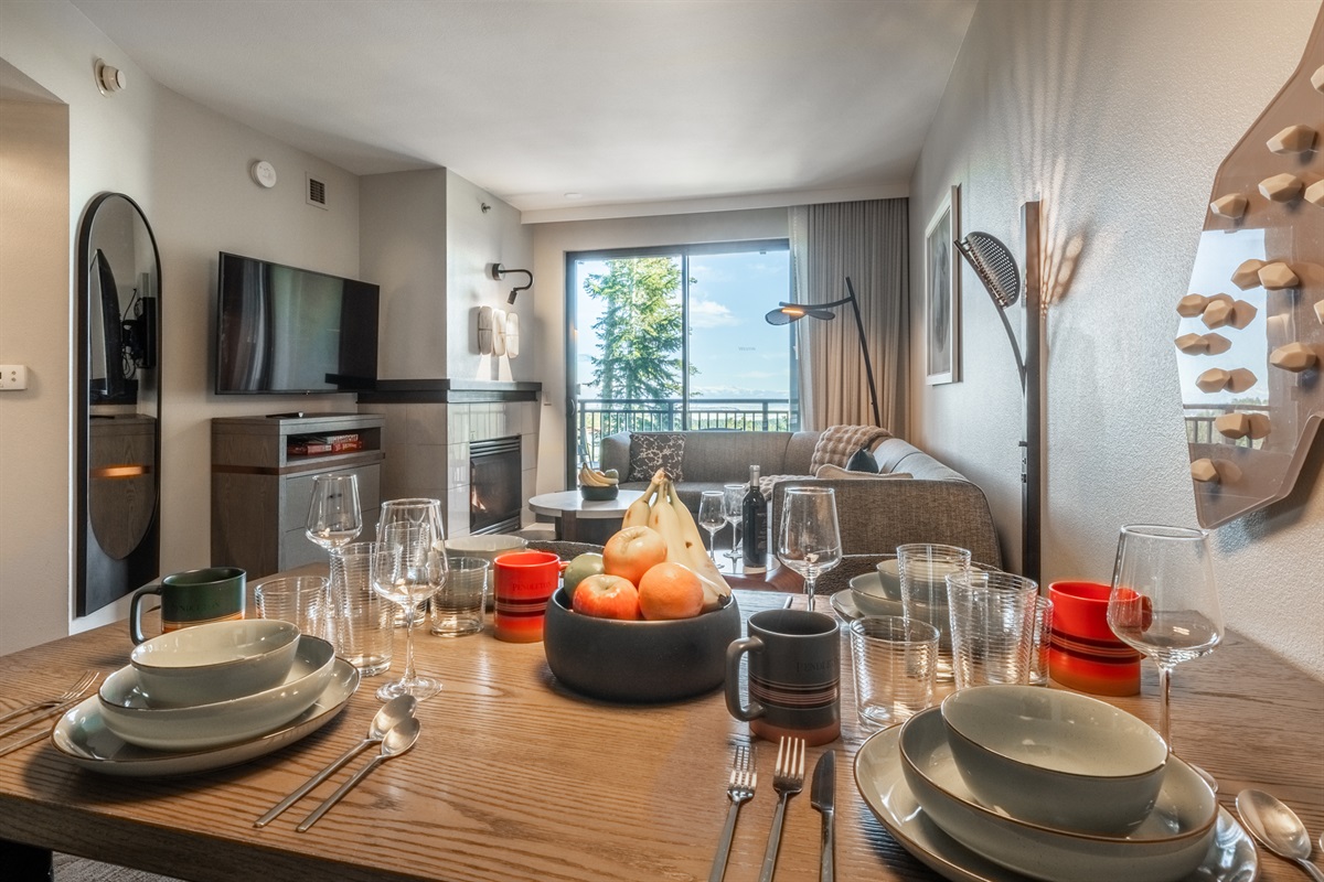 The dining area sits comfortably within the open layout, making it easy to share meals, plan the day, or linger over coffee while staying connected to the rest of the space.