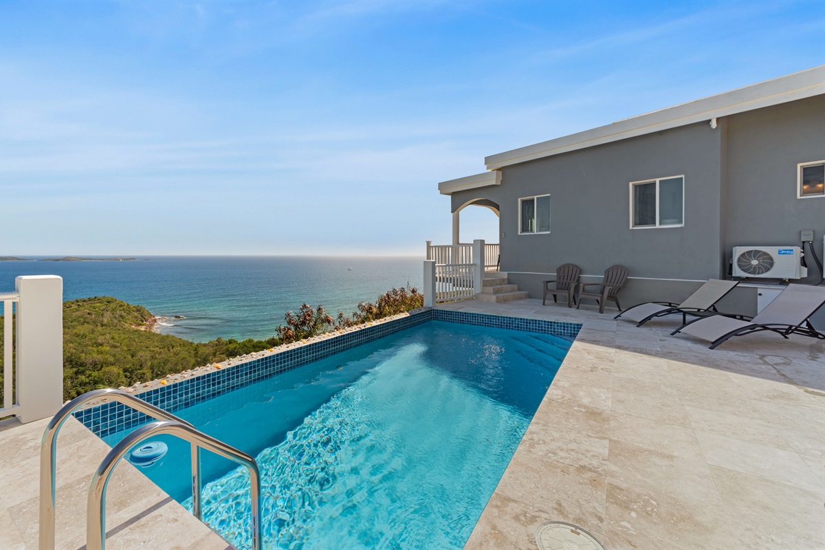 Take a refreshing dip in your private pool overlooking the hillside.