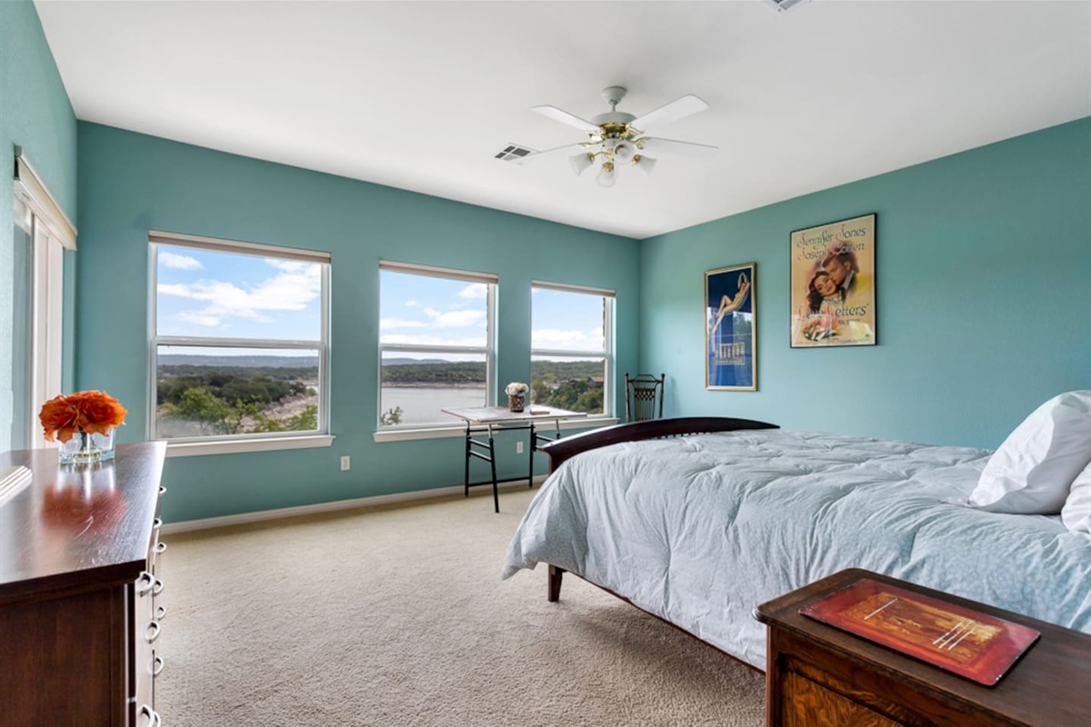 Master bedroom with a lake view