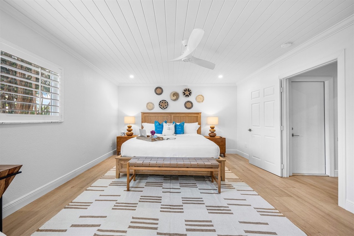Generous proportions and calming design make this primary suite a true escape, blending comfort with understated luxury.