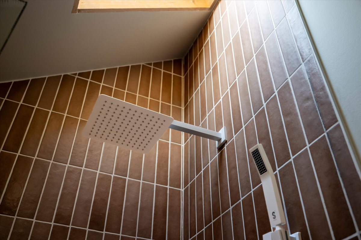 The Penthouse: Rainfall shower, ceiling skylight and provided shampoo/conditioner/body wash.