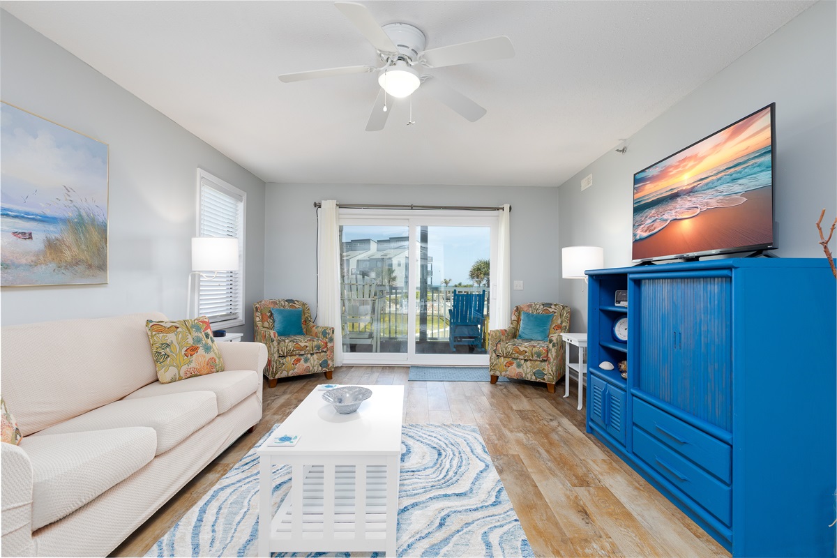 Spacious living room with a large glass door