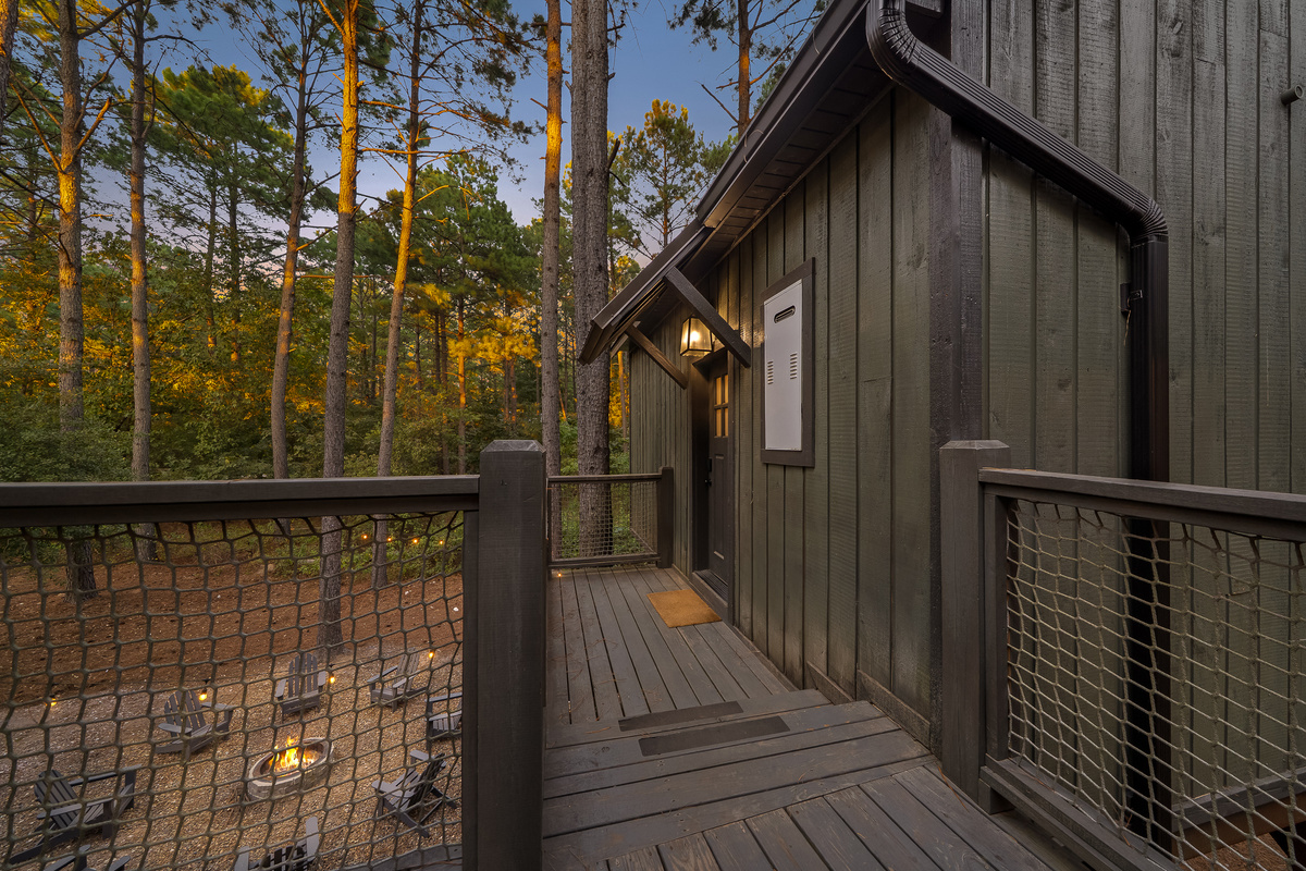 Step outside the main living space and follow the elevated walkways through the trees to your private bedroom retreat.