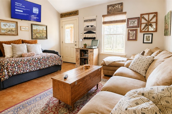 The Gathering Room is where camp conversations turn into core memories. Open to the kitchen and dining room, this cozy space keeps everyone connected whether you’re cooking dinner, watching the game or playing on the chalkboard wall.