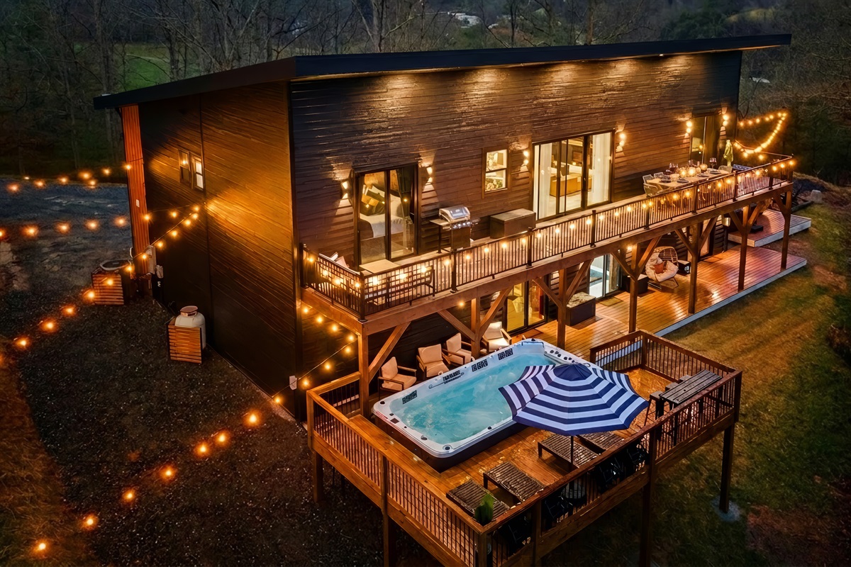 {Summit House} Welcome to Summit House — a modern speakeasy estate for up to 20 guests. Enjoy panoramic Blue Ridge views, a hot tub, sauna, fire pit lounge, and expansive indoor-outdoor spaces designed for gathering, celebrating, and unwinding in style.