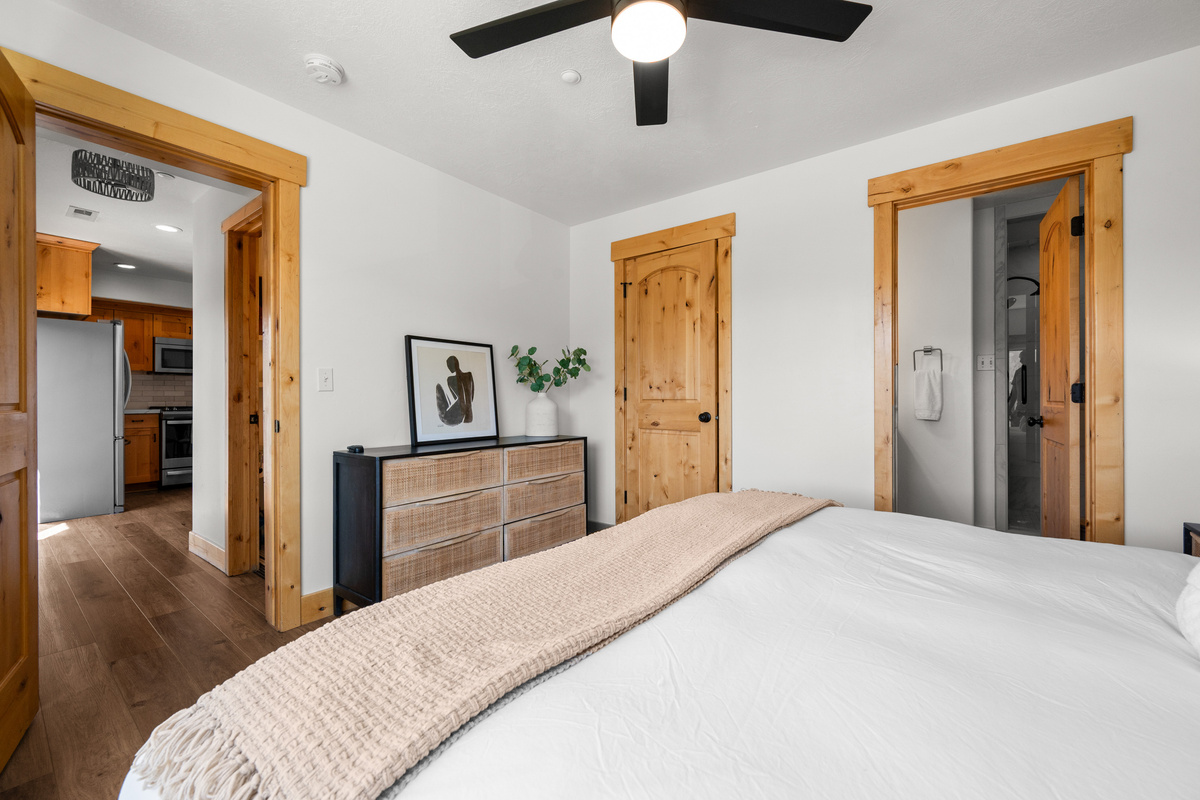 A thoughtfully arranged bedroom provides a peaceful space to recharge at the end of the day.