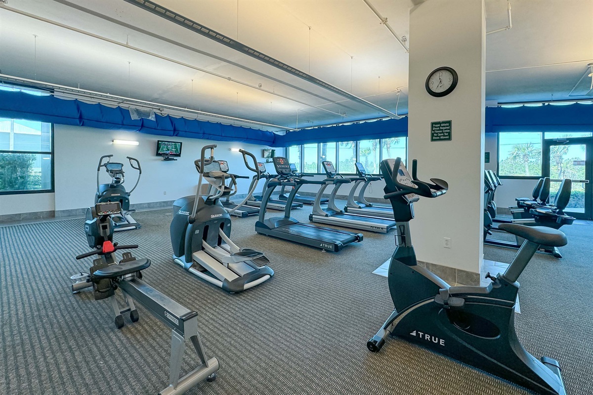 On-site fitness center with panoramic ocean views, providing residents with a premium wellness experience.