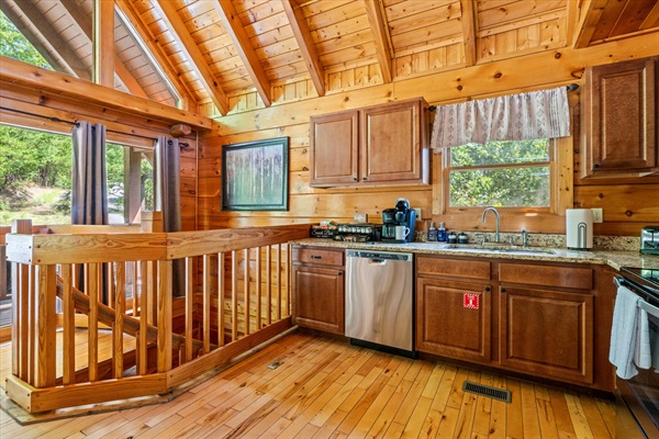 Two more king suites, a theater room, and a deck await on the lower level—easy to reach via spiral stairs.