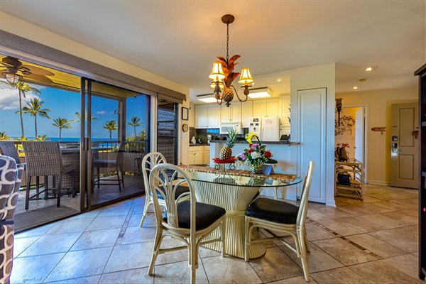 Living room and Dining area inside or out on the Lanai with a view of the ocean 