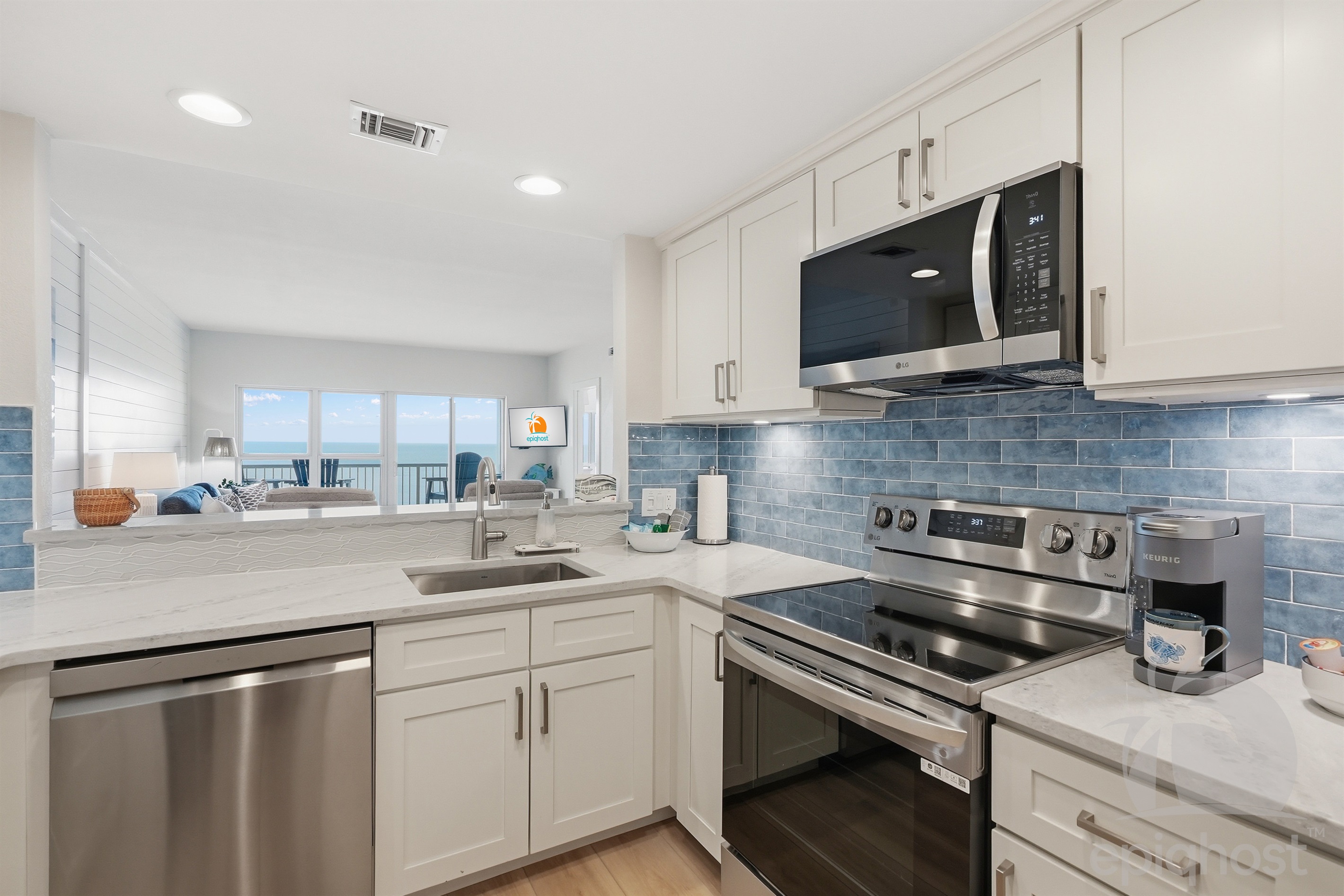 Kitchen with stainless appliances and bay-tile backsplash