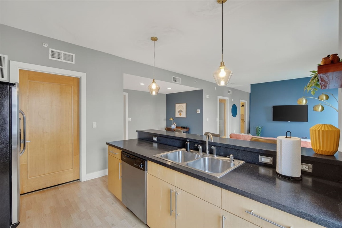 Enjoy cooking in a fully equipped kitchen with spacious counters, stainless appliances, and a sleek modern design. The open layout keeps you connected to the living and dining spaces.
