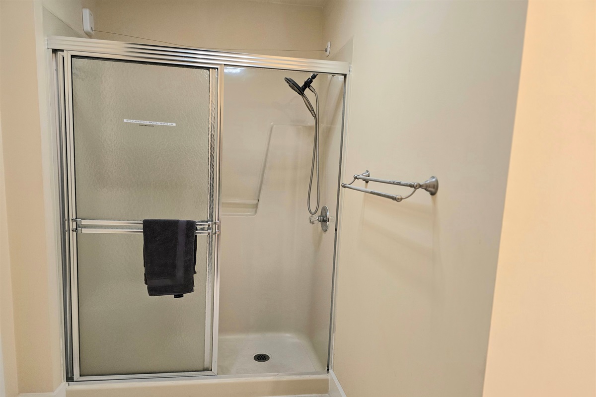 The easy walk in shower has a built-in seat and convertible magnetic showerhead.