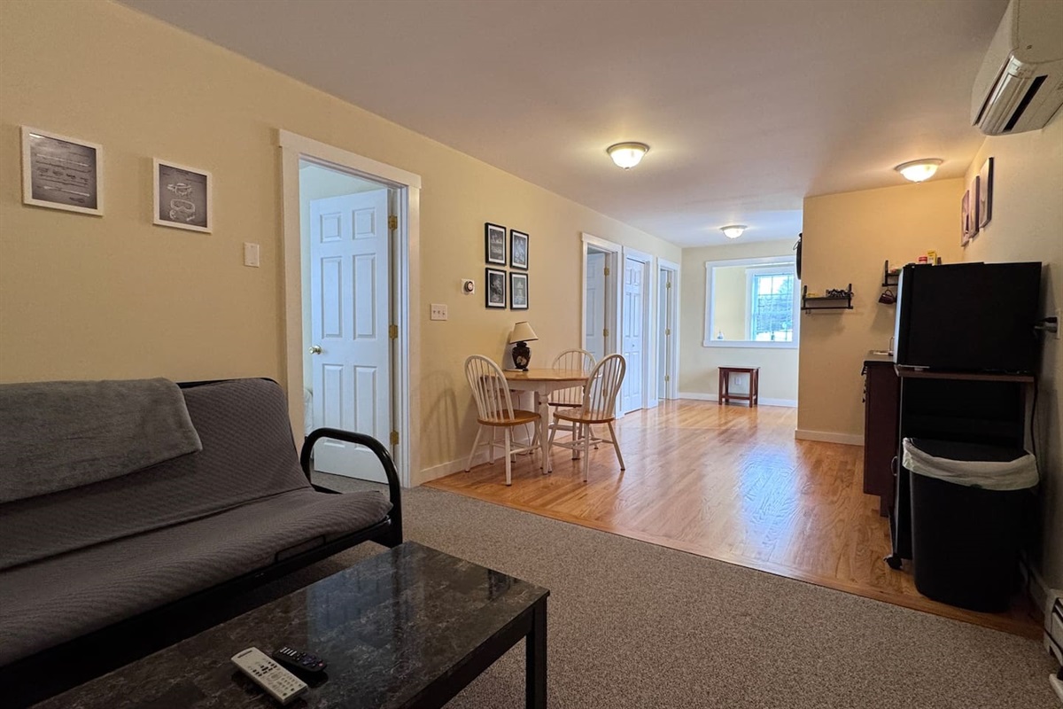 Open concept with Kitchenette, Living room, and dining area with both bedrooms and bathrooms off of the space