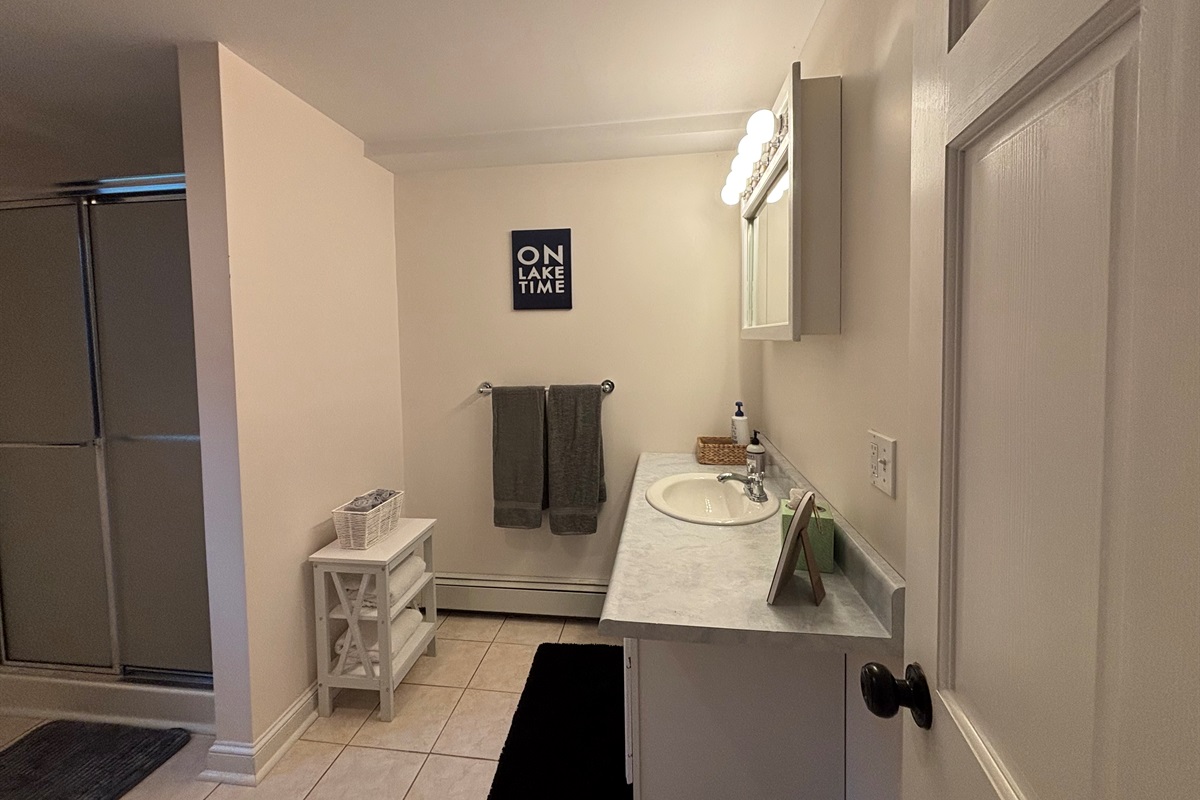 Spacious bathroom with shower and laundry