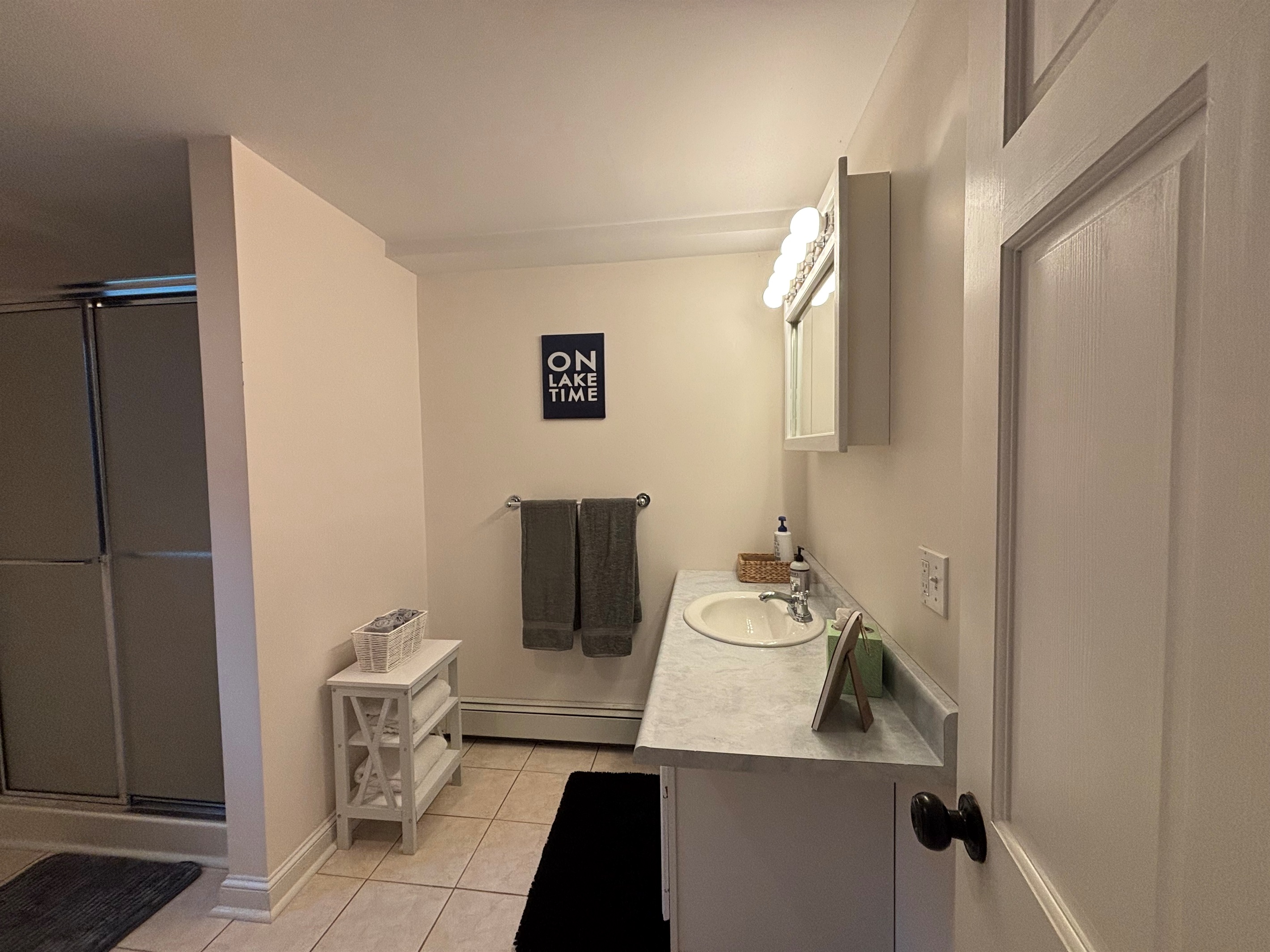 Spacious bathroom with shower and laundry