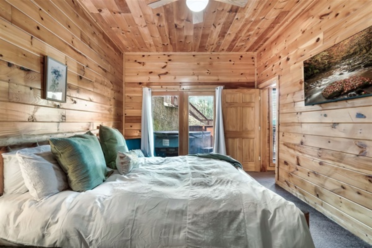 Retreat to a lower level king bedroom with a cozy fireplace and private ensuite, perfect for grandparents or couples