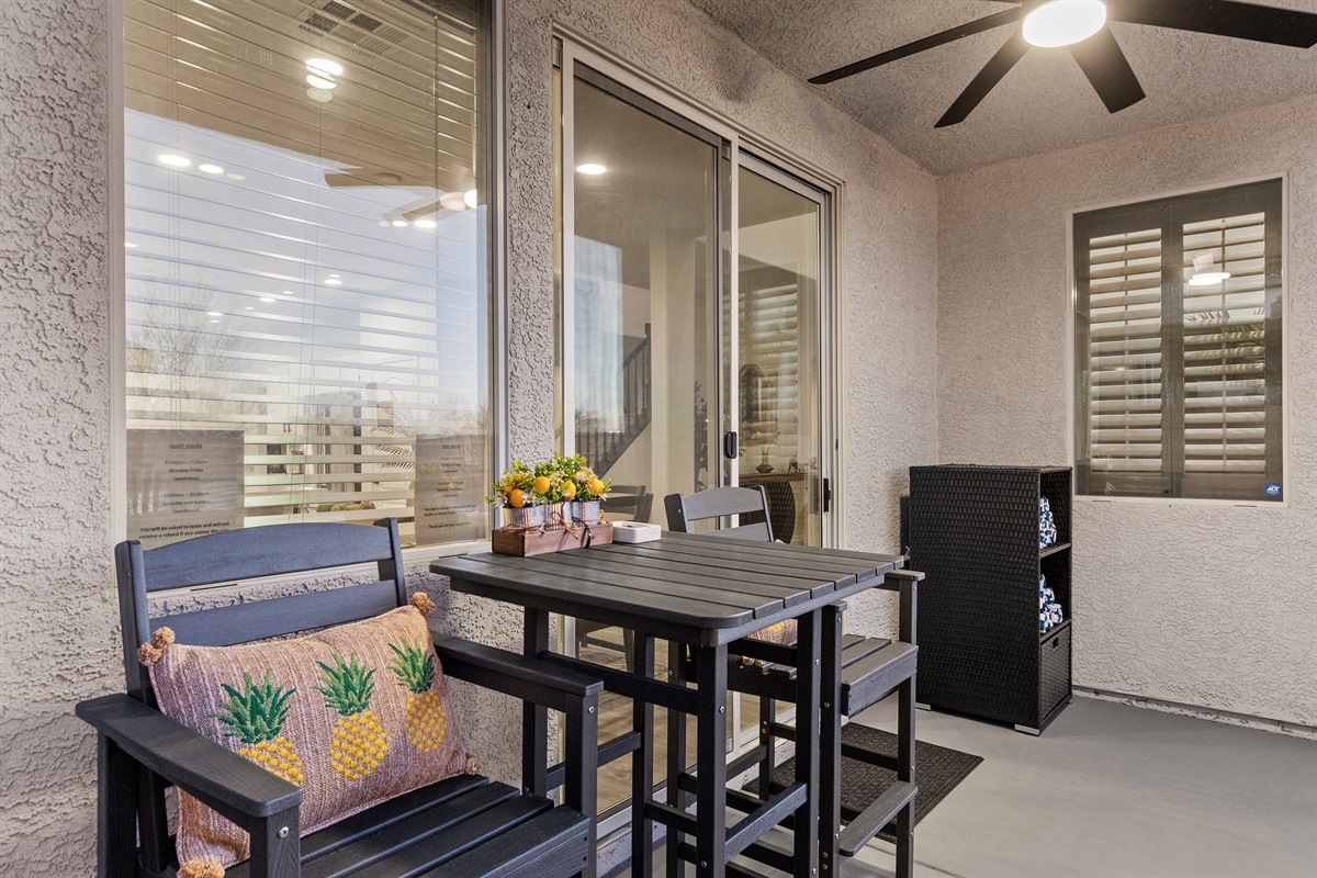 Cozy patio seating.  Pool towels provided.  -It's Showtime!