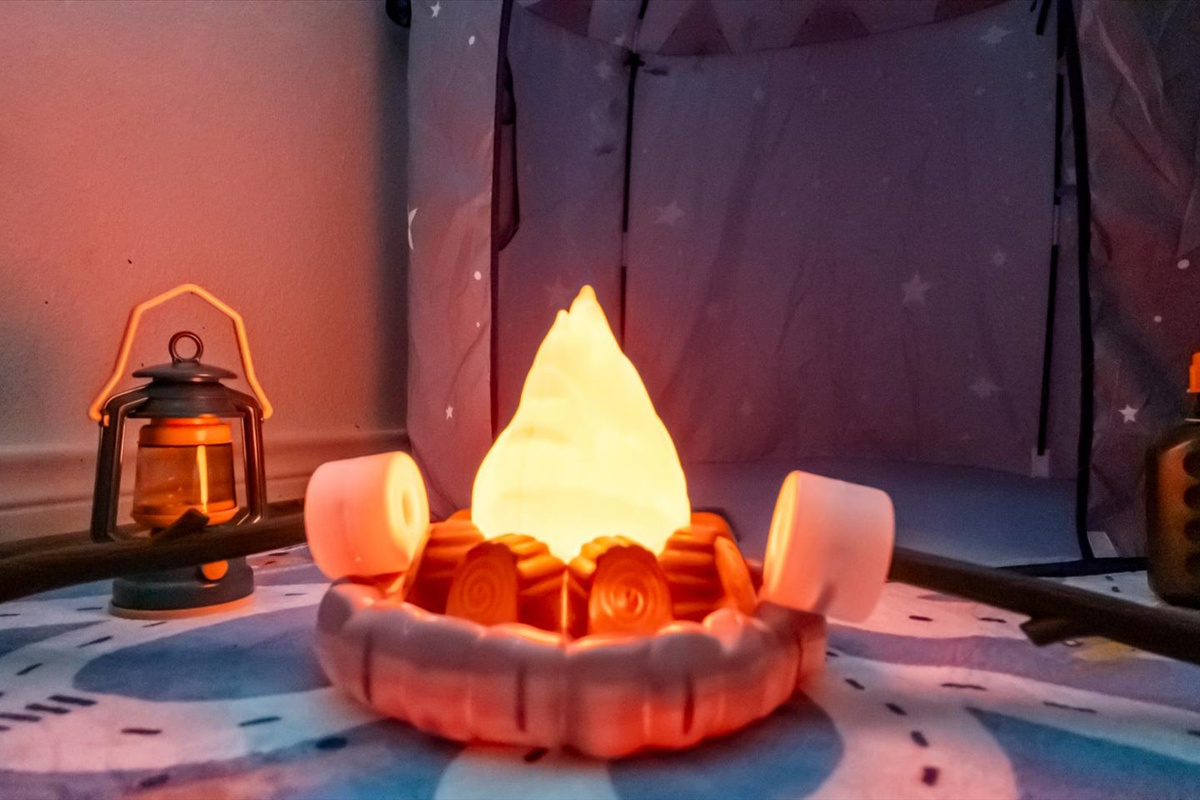 Fairy lights, a camping tent and a pretend bonfire add to the imaginary fun in the large space for littles. 
