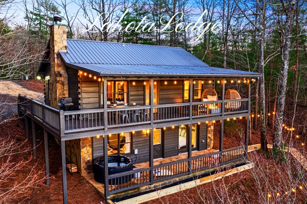 Welcome to Lakota Lodge! Gather in the spacious living room for family time, board games, or simply unwinding by the wood burning fire place.