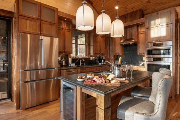 This kitchen has everything you need for preparing delicious meals, complete with modern appliances and a rustic touch.