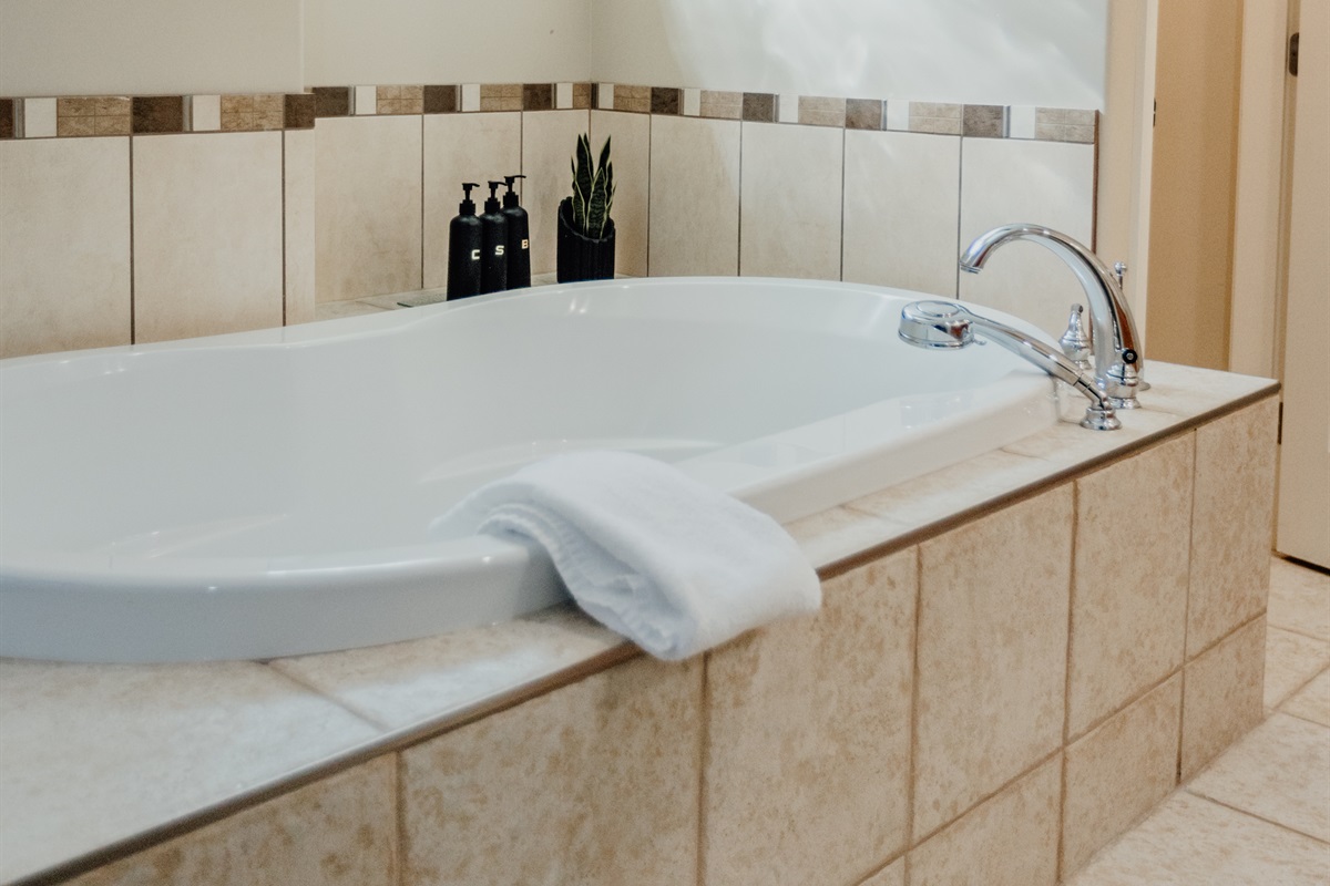 Unit A Soaker tub right in primary suite.