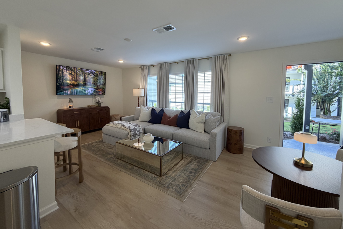The dining table sits by the glass door out to the ground-floor patio.