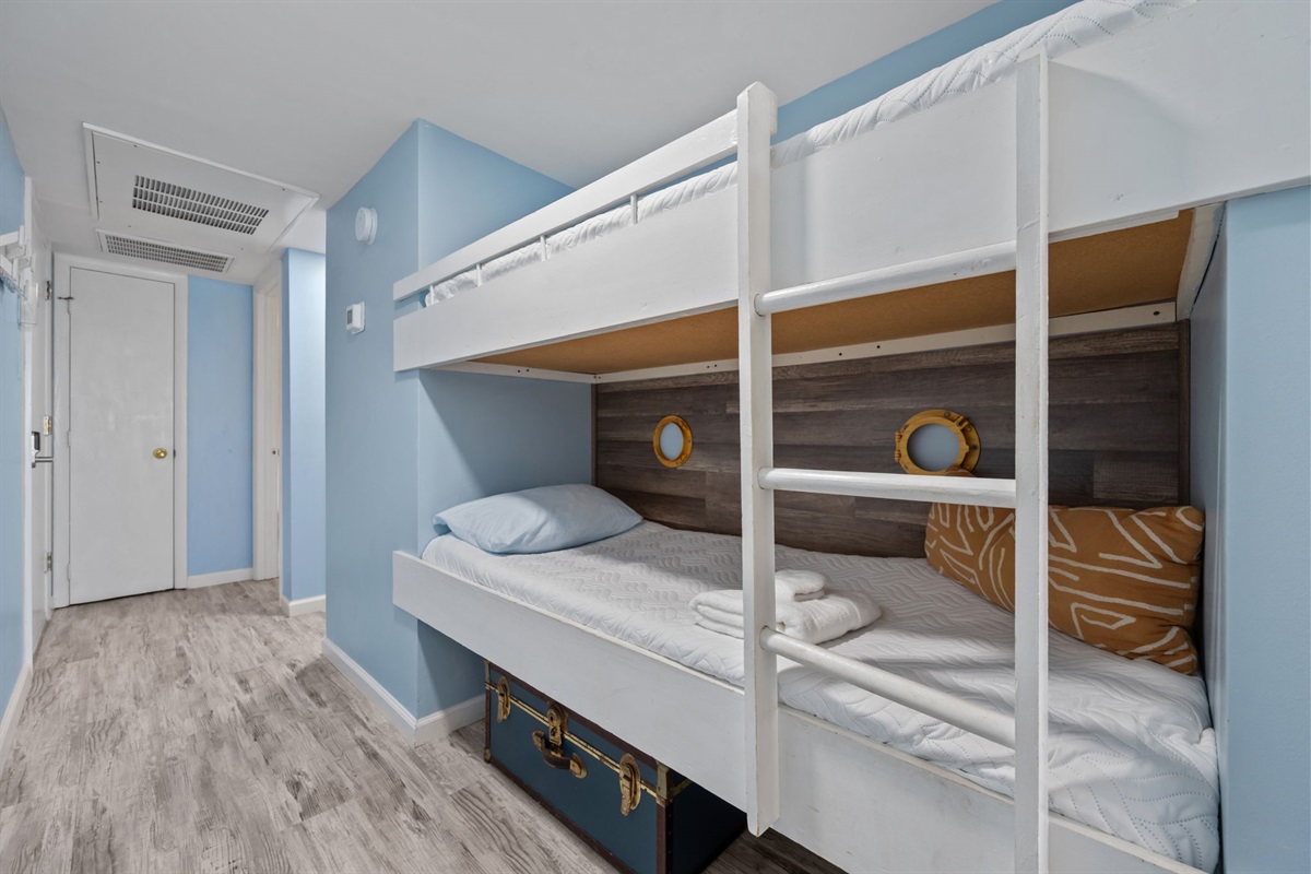 Smart layout with hallway access to bunks, bathroom, and in-unit laundry